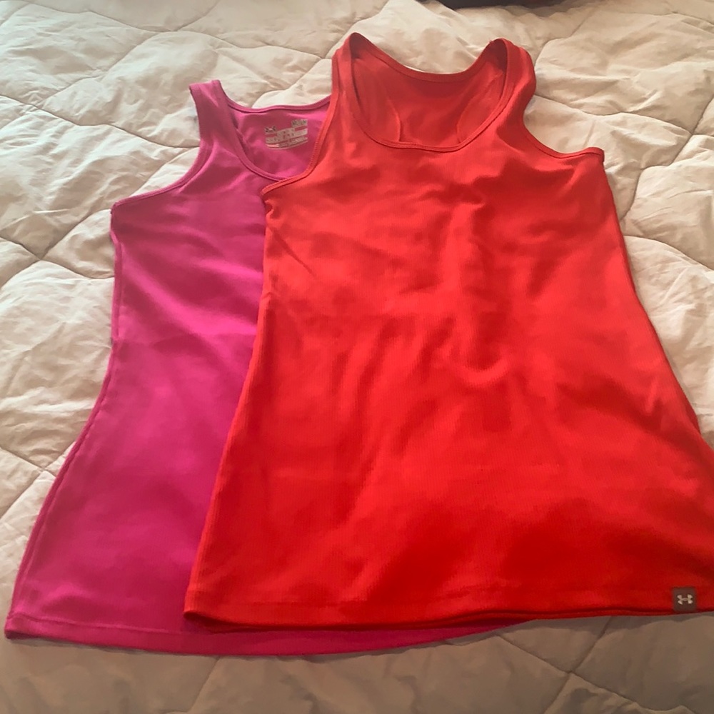 Under armor heat gear tanks. Pink is M. Red is S